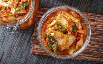  Korean kimchi, made of salted and fermented vegetables, contains microbes that contribute to its distinctive taste. 4kodiak/Getty Images 